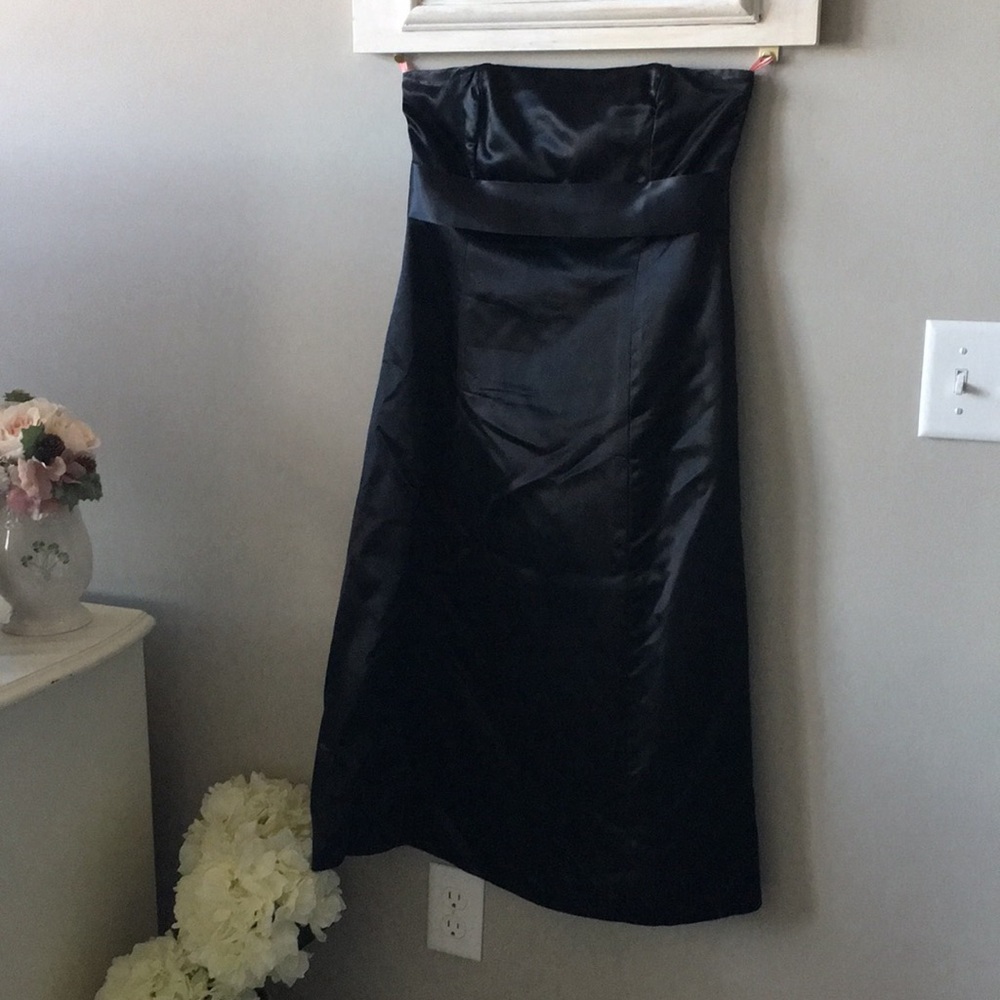 Black satin strapless dress.